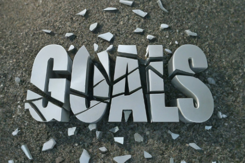 The word Goals shattered on the ground like a mirror