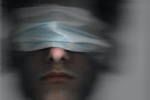 Blind folded man....blurry